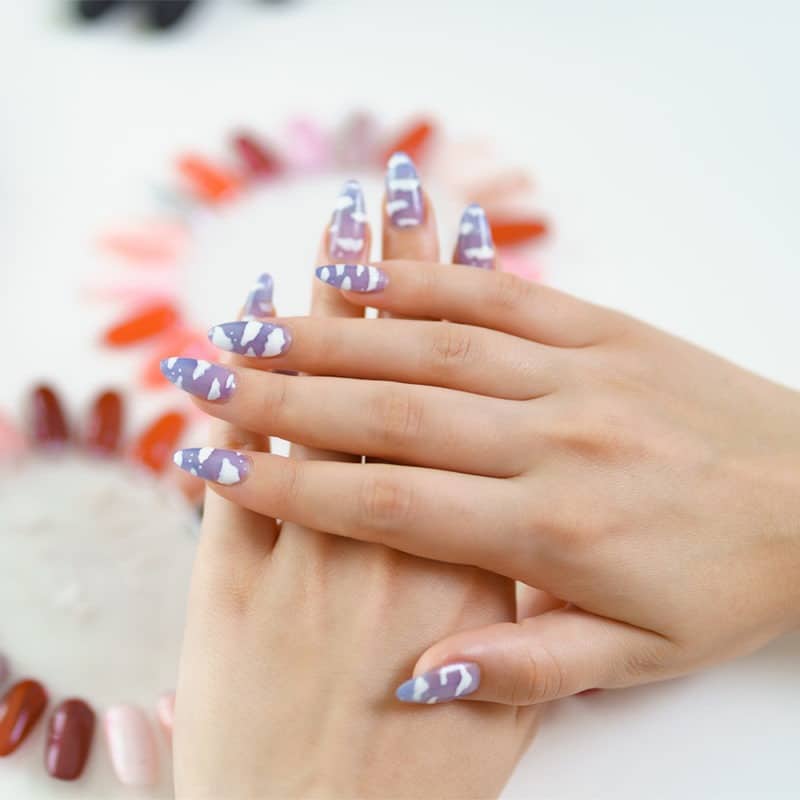 beautiful manicure on color palette background e1643346460858